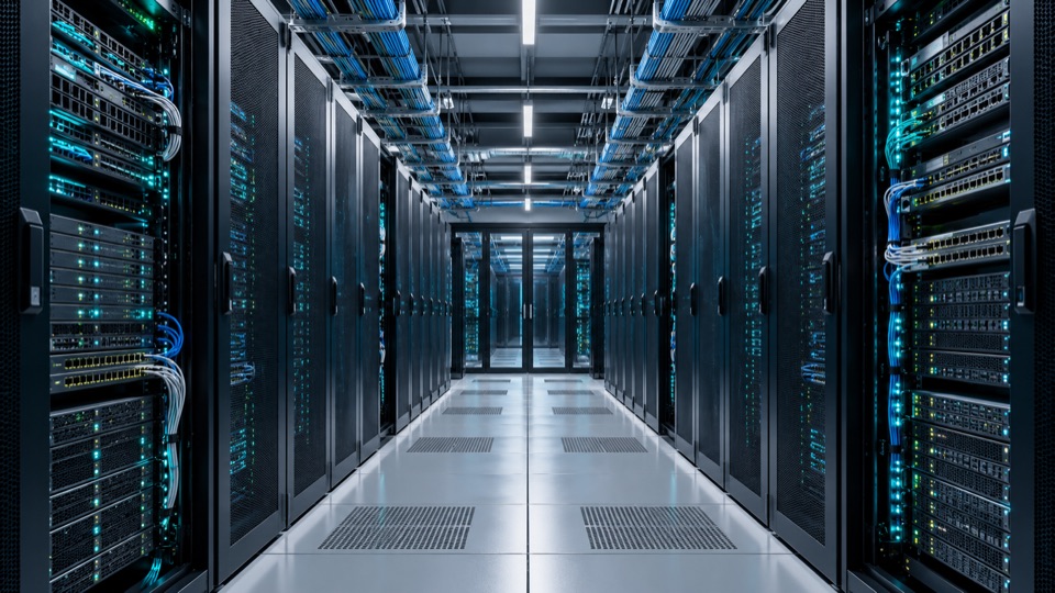Rows of server racks and network equipment in a data centre aisle